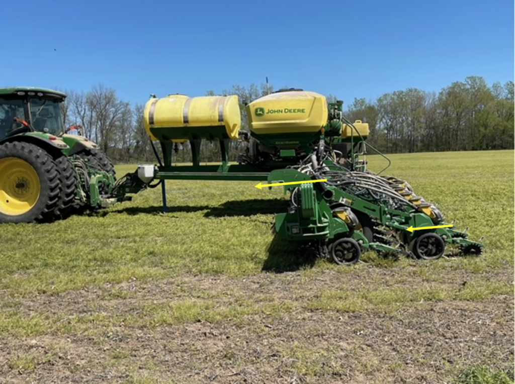 John Deere planter in a field.